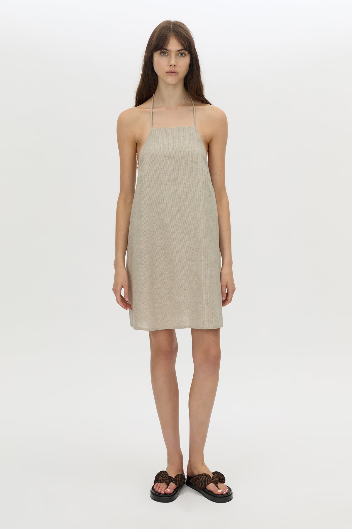 Front-styled view CAMILLA AND MARC Phostre Halter Mini Dress in sand with a halter neckline.