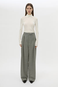 Front styled view CAMILLA AND MARC Ren Pant in Charcoal Herringbone with wide‑leg double pleats and tailored detailing.