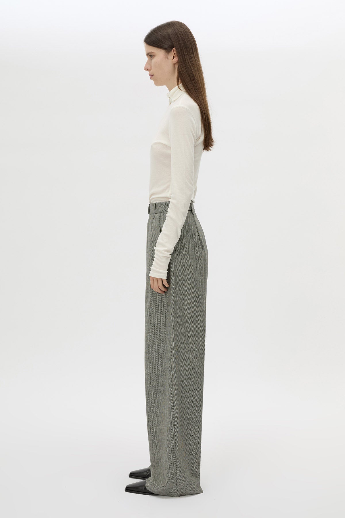 Side view CAMILLA AND MARC Ren Pant in Charcoal Herringbone with wide‑leg double pleats and tailored detailing.