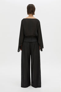 Back view CAMILLA AND MARC long-sleeve Rene Draped Top in black with a boat neckline.