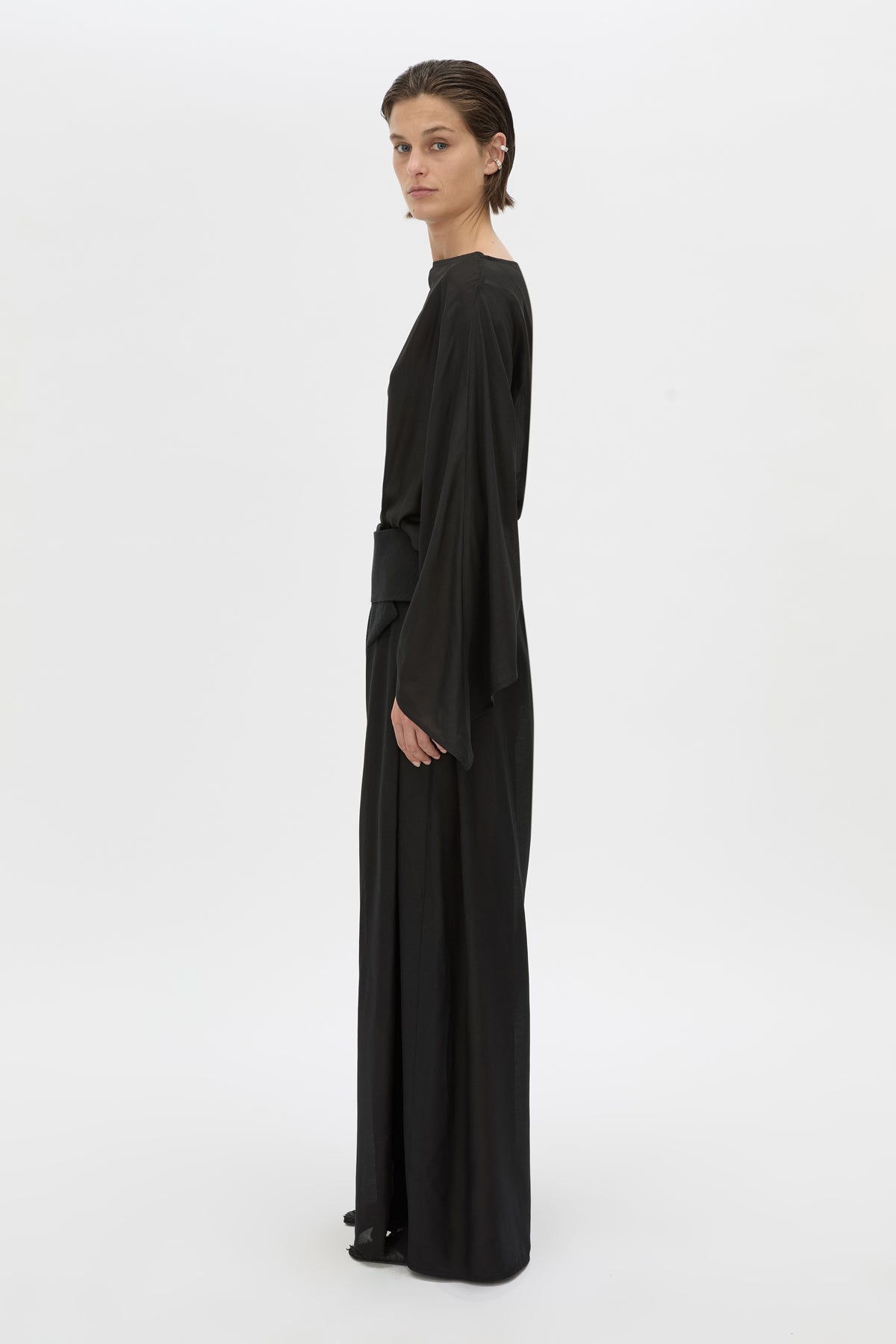 Side view CAMILLA AND MARC Rene Wide-Leg Pant in black with a removable folded belt and georgette shorts.