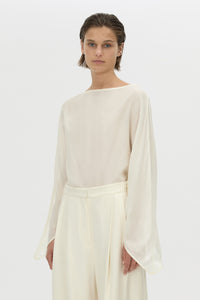 Cropped view CAMILLA AND MARC long-sleeve Rene Draped Top in cream with a boat neckline.