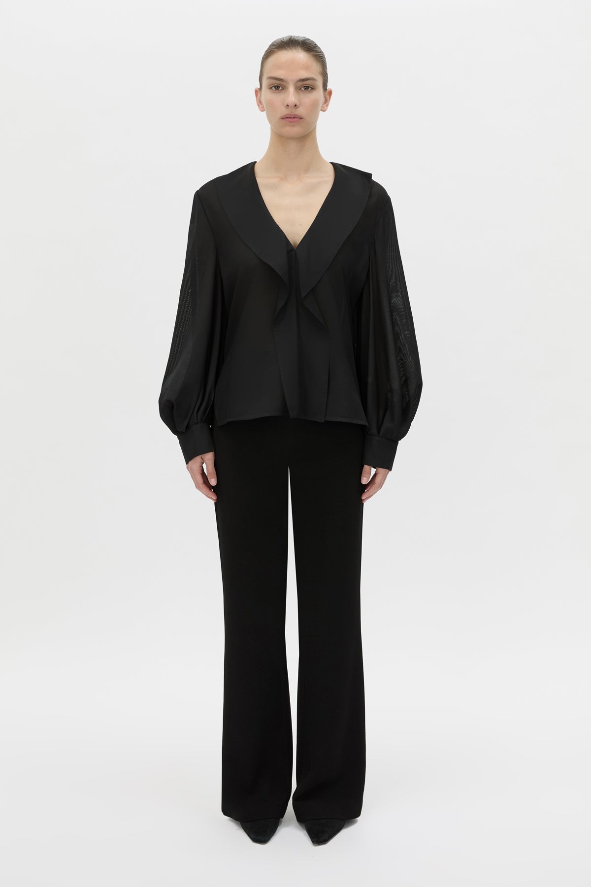 Front view CAMILLA AND MARC Rene Long Sleeve Top in black with adjustable neckline and blouson sleeves.