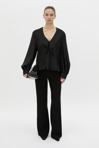 Front-styled view CAMILLA AND MARC Rene Long Sleeve Top in black with adjustable neckline and blouson sleeves.