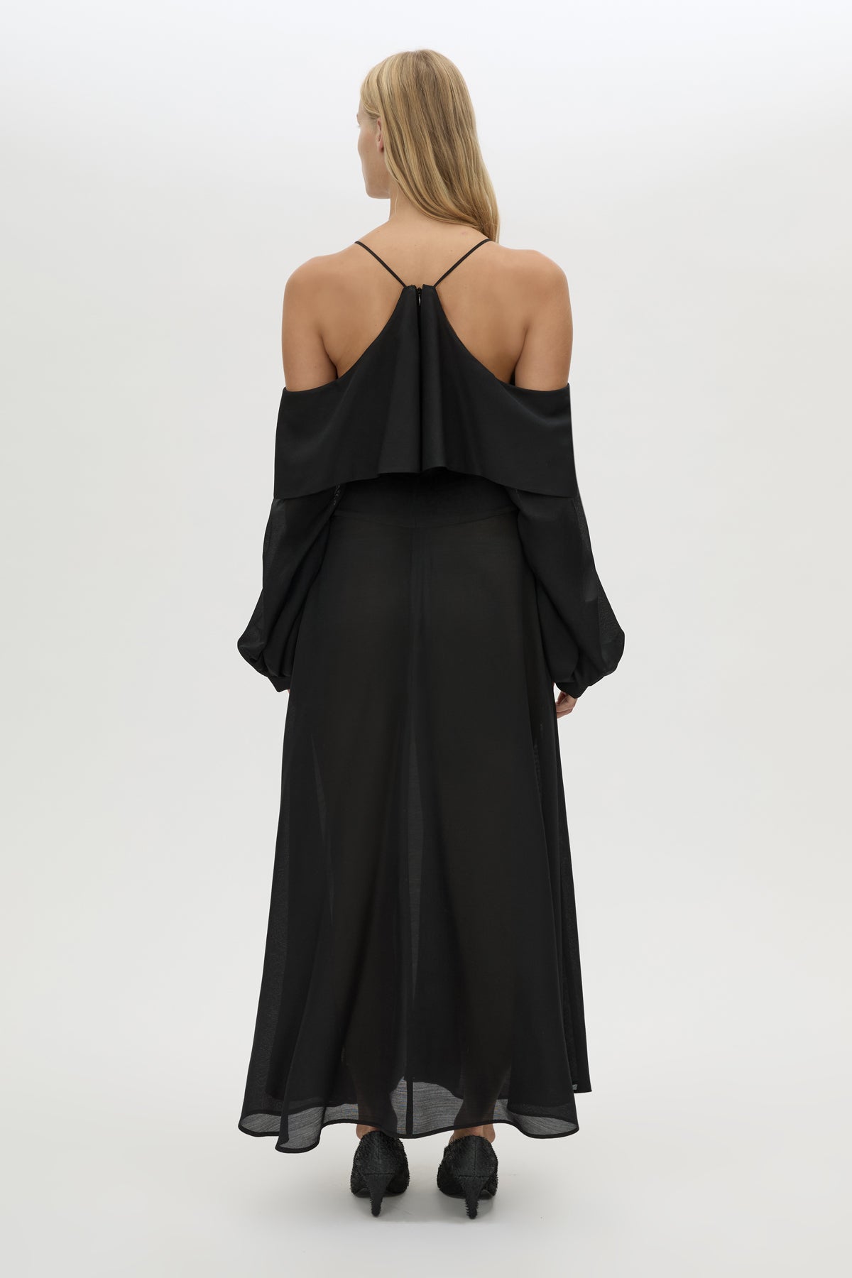 Back view CAMILLA AND MARC long-sleeve Rene Maxi Dress in black with exposed shoulder sleeves.
