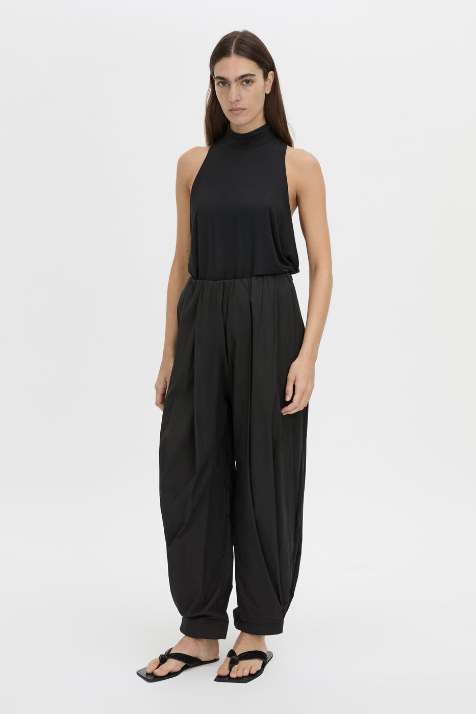 Front-styled view CAMILLA AND MARC Rhia Balloon Leg Pant in black with an encased gathered elastic waistband.
