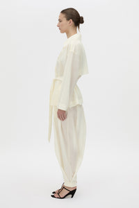 Side view CAMILLA AND MARC Rhia Sheer Cropped Trench in ivory white with a relaxed fit.