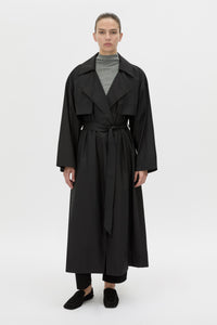Front-styled view CAMILLA AND MARC Rhia Sheer Full Length Trench in black with a relaxed fit.