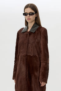 Cropped view CAMILLA AND MARC Rina Coat in Chocolate Brown calf hair with contrast leather collar.