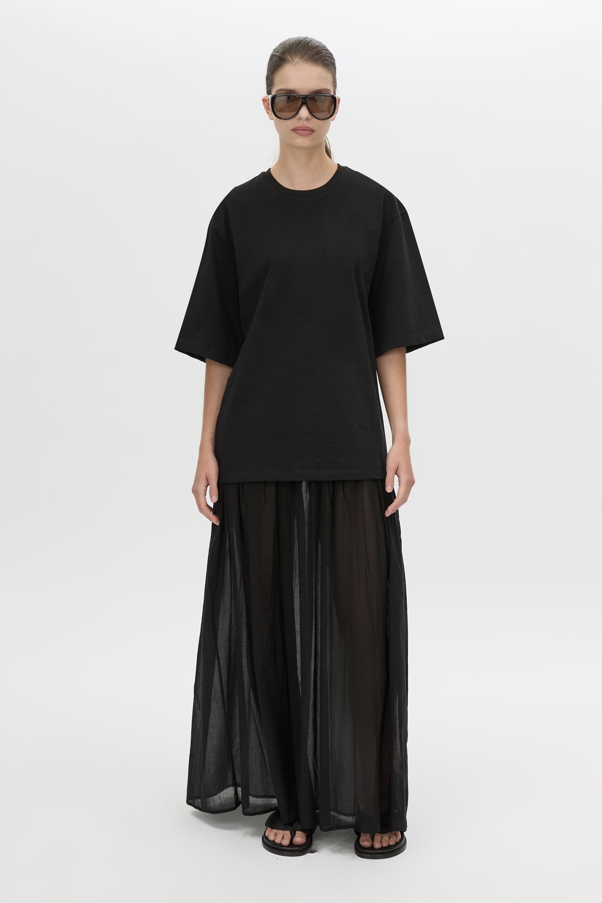 Front-styled view CAMILLA AND MARC Romy Contrast Maxi Dress in black with upper cotton tee‑shirt and sheer voile extension.