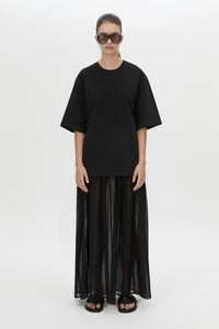 Front view CAMILLA AND MARC Romy Contrast Maxi Dress in black with upper cotton tee‑shirt and sheer voile extension.