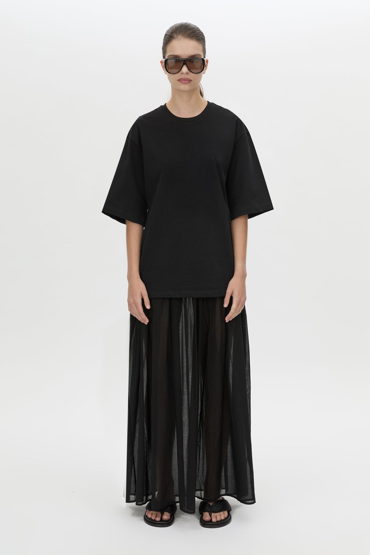 Front view CAMILLA AND MARC Romy Contrast Maxi Dress in black with upper cotton tee‑shirt and sheer voile extension.