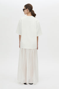 Back view CAMILLA AND MARC Romy Contrast Maxi Dress in soft white with upper cotton tee‑shirt and sheer voile extension.