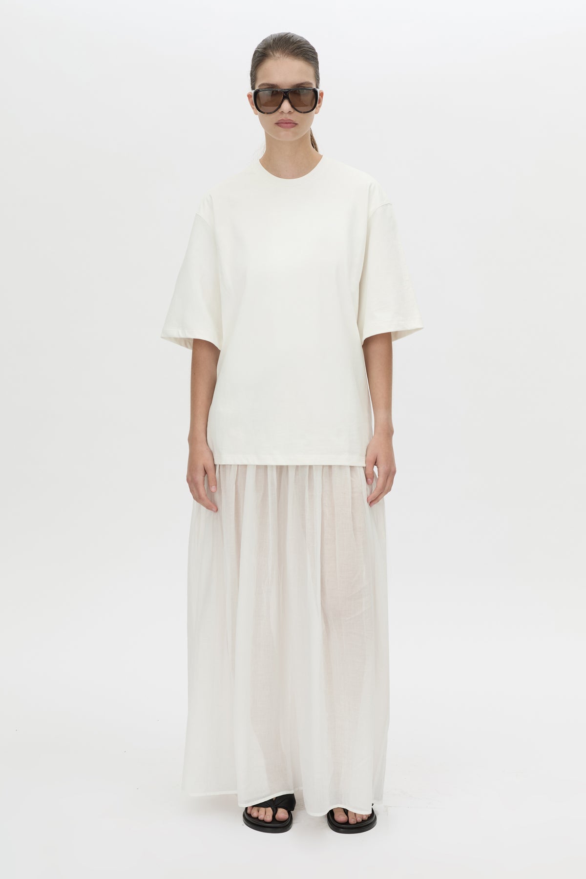 Front-styled view CAMILLA AND MARC Romy Contrast Maxi Dress in soft white with upper cotton tee‑shirt and sheer voile extension.