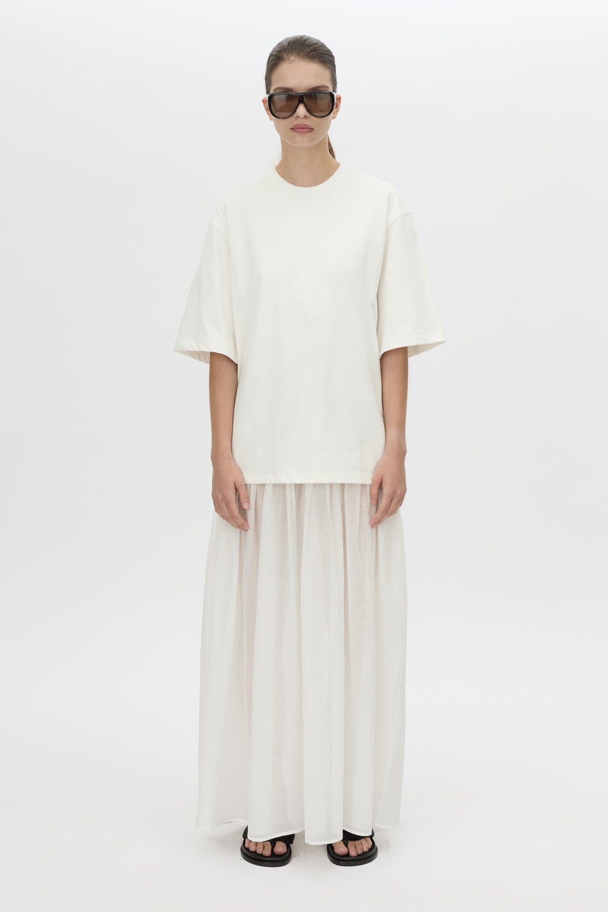 Front view CAMILLA AND MARC Romy Contrast Maxi Dress in soft white with upper cotton tee‑shirt and sheer voile extension.