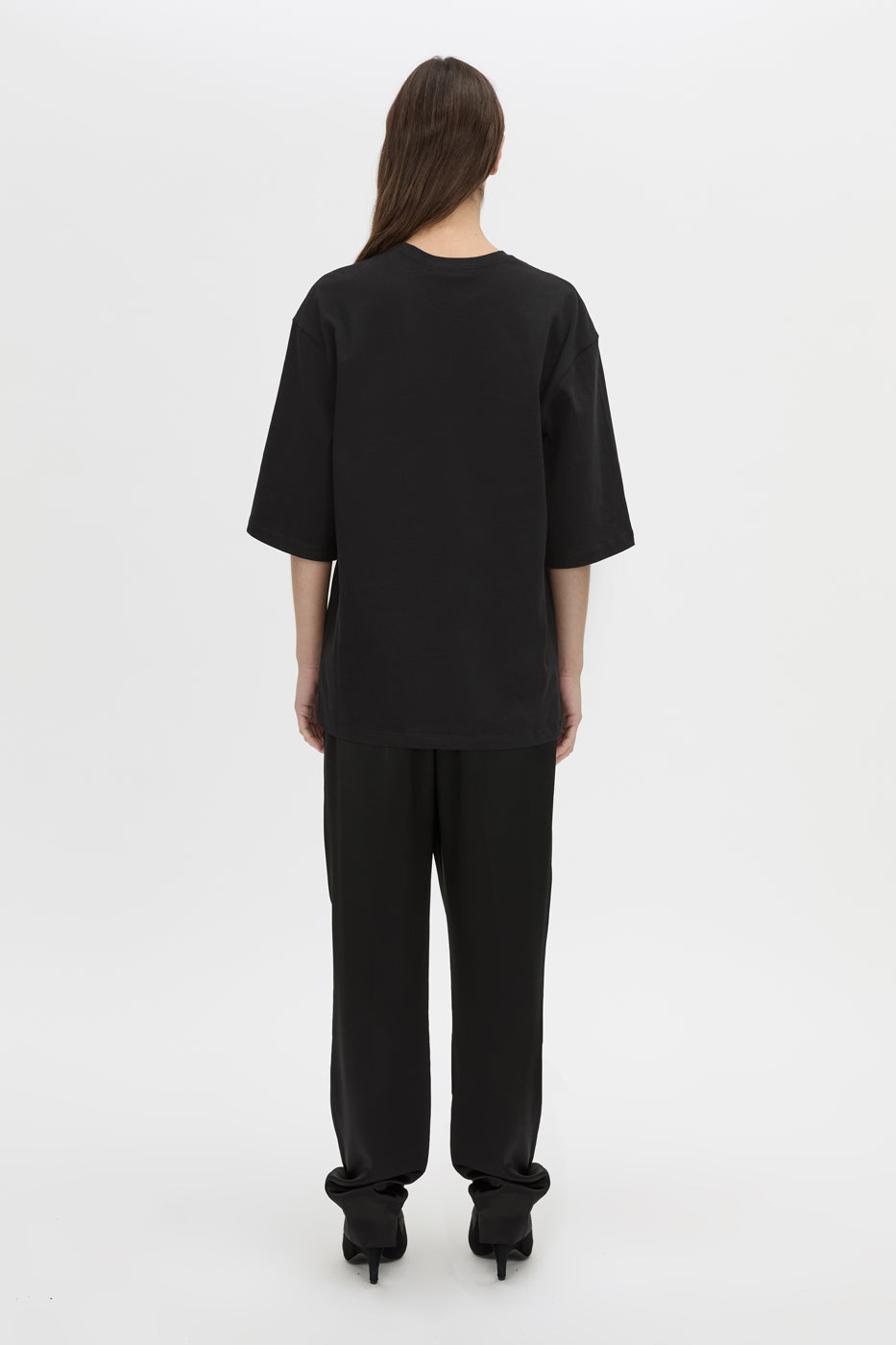 Back view CAMILLA AND MARC Romy Oversized Tee in black with tubular ribbed bound neckline.
