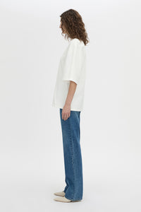 Side view CAMILLA AND MARC Romy Oversized Tee in white with tubular ribbed bound neckline.