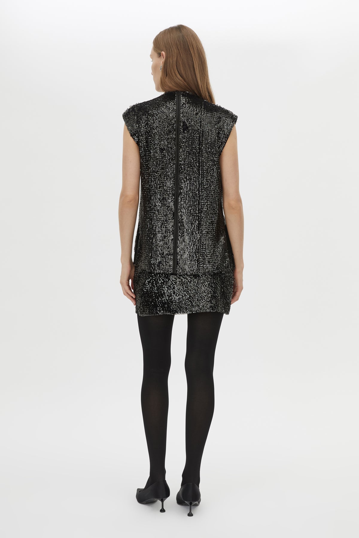 Back view CAMILLA AND MARC Sabel Skirt in Black with sequin finish and micro‑mini silhouette.