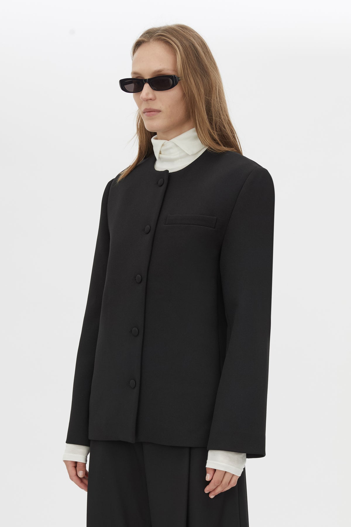 Close Up View CAMILLA AND MARC San fitted collarless blazer in black with Front button closure.