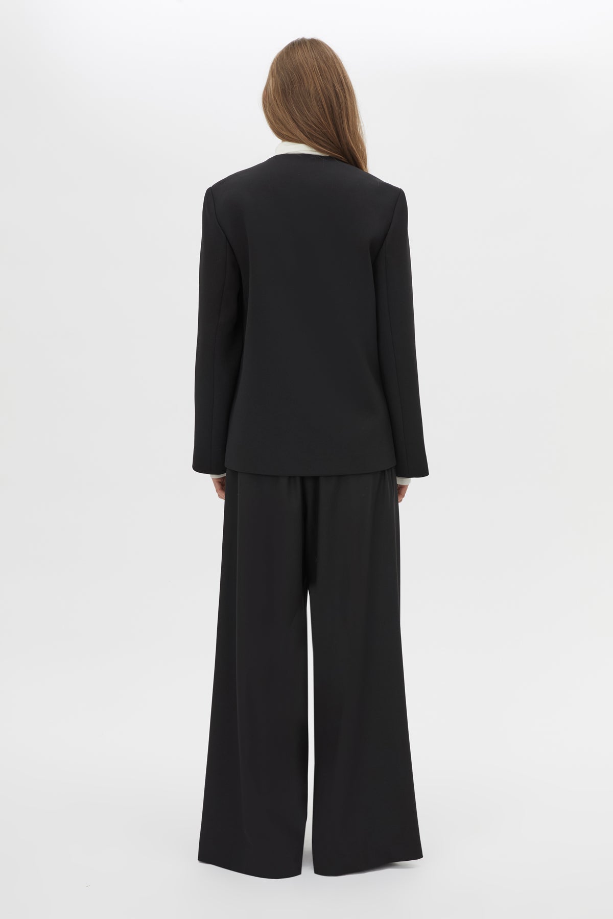 Back View CAMILLA AND MARC San fitted collarless blazer in black with Front button closure.
