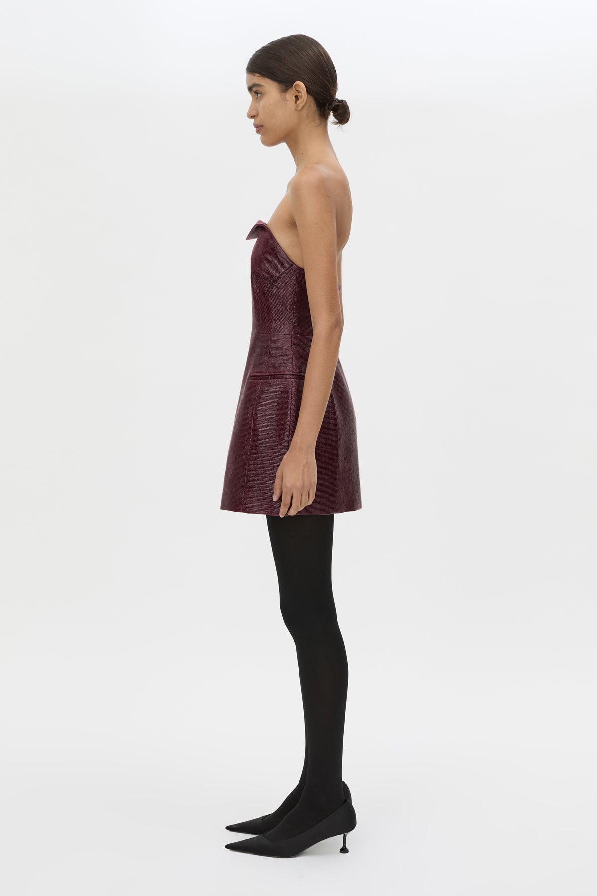 Side view CAMILLA AND MARC Sana Strapless Mini Dress in Burgundy with tailored finish and internal fitted bodice.