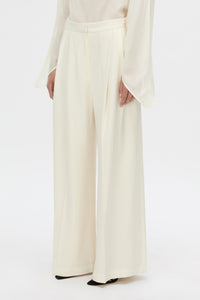 Styled view CAMILLA AND MARC high-waisted Selin Suit Pant in cream.