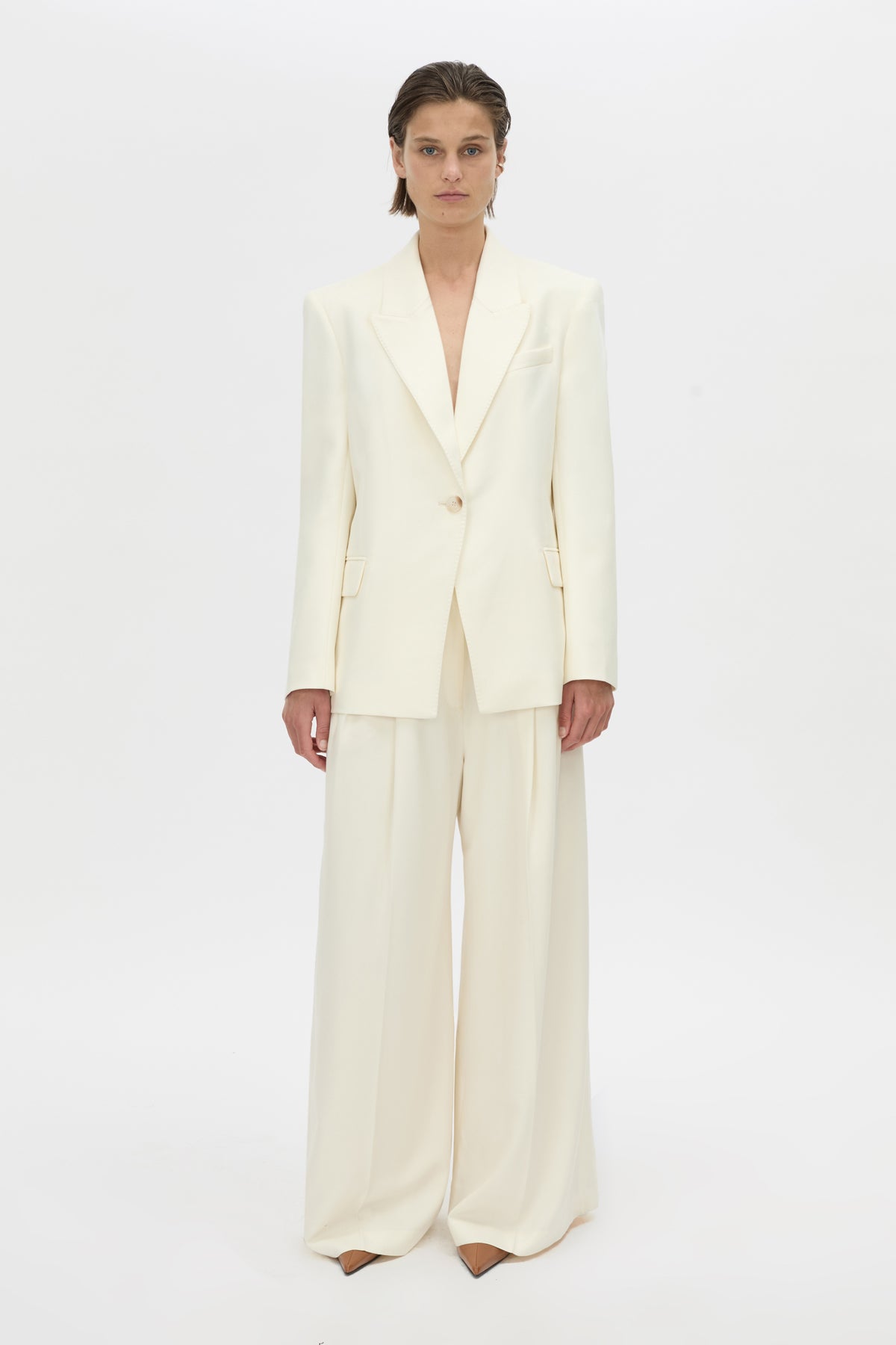 Front-styled-2 view CAMILLA AND MARC high-waisted Selin Suit Pant in cream.