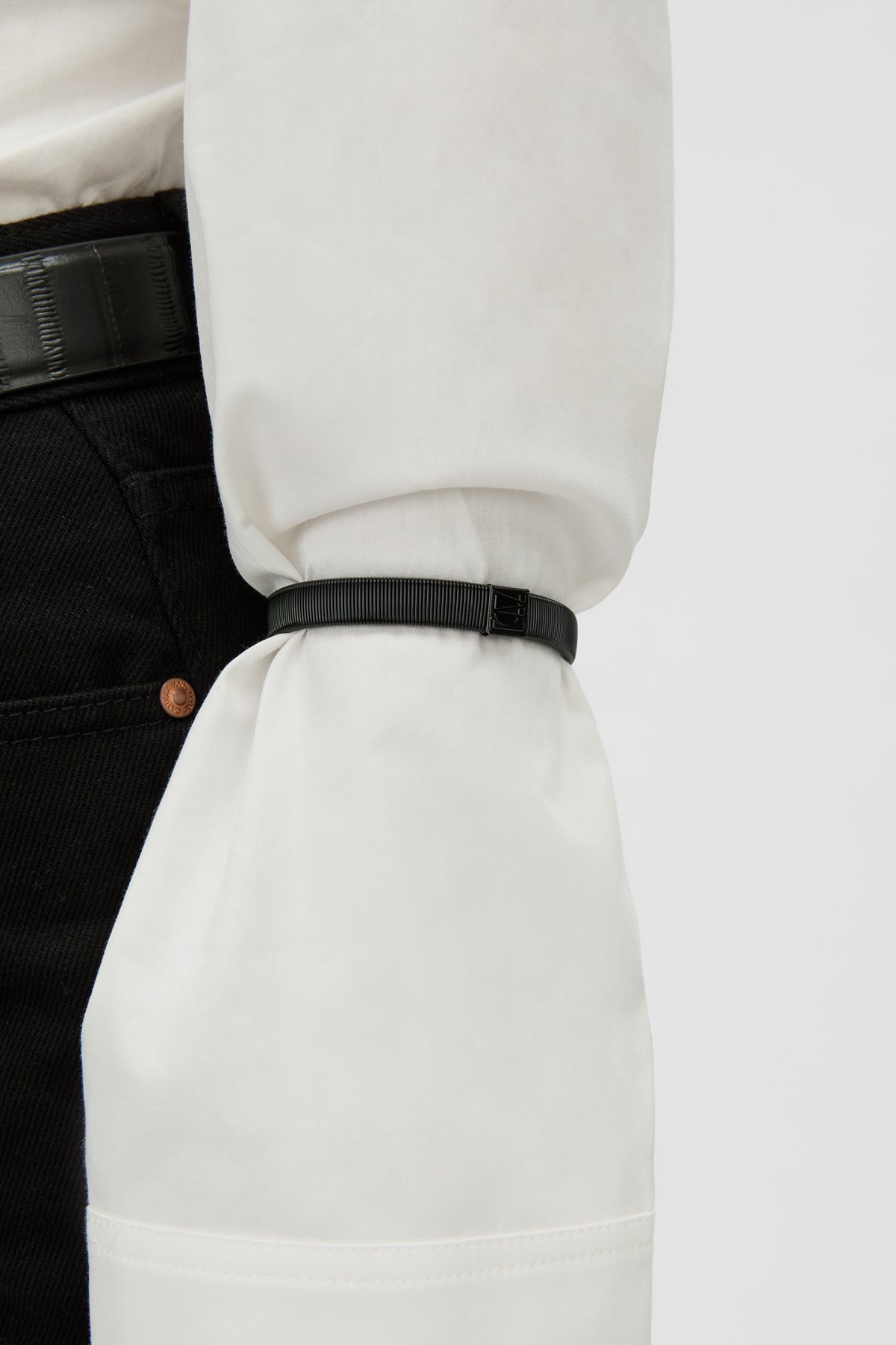 Close up View - CAMILLA AND MARC Sleeve Monogram garter pair in black. Worn on the arm to perfectly bunch up 