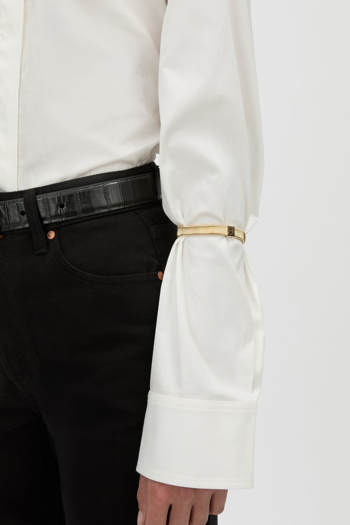Front View - CAMILLA AND MARC Sleeve Monogram garter pair in gold. Worn on the arm to perfectly bunch up any sleeve.