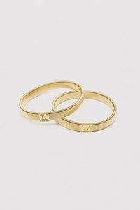 Ghost View - CAMILLA AND MARC Sleeve Monogram garter pair in gold. 