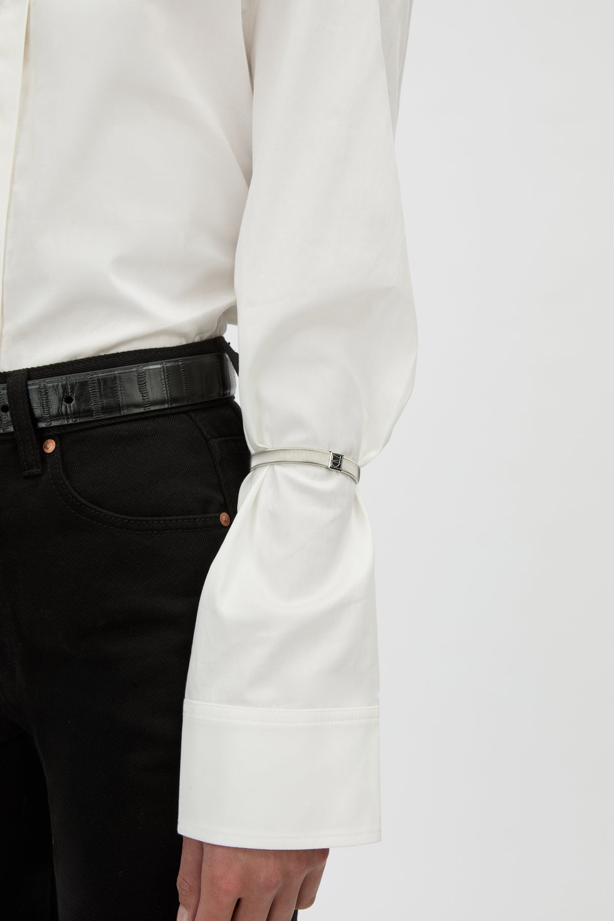 Front View - CAMILLA AND MARC Sleeve Monogram garter pair in silver. Wear with your favourite shirt, blazer, or coat.