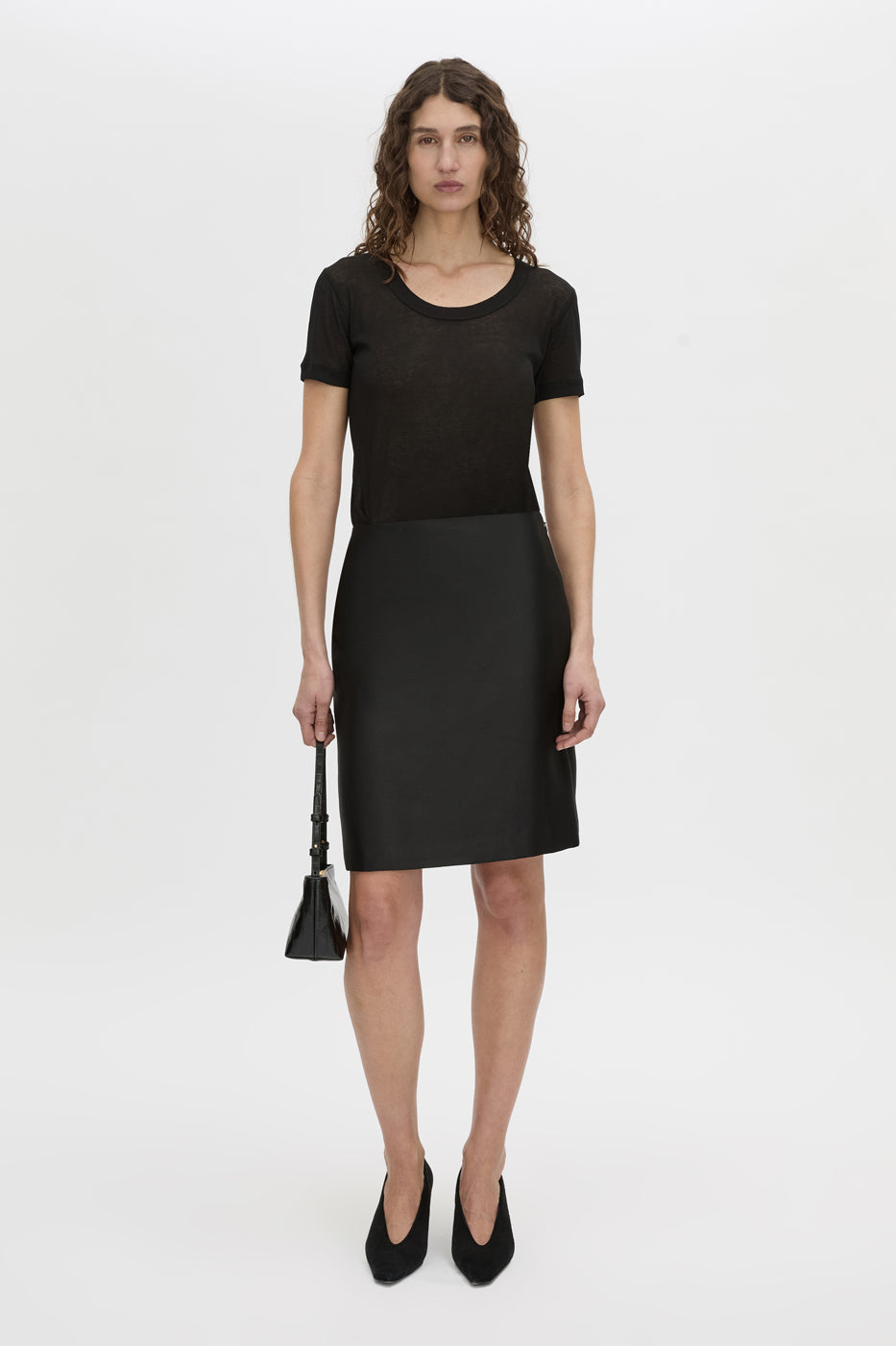 Front-styled view CAMILLA AND MARC Sona Pencil Skirt in black with knee‑length hem.