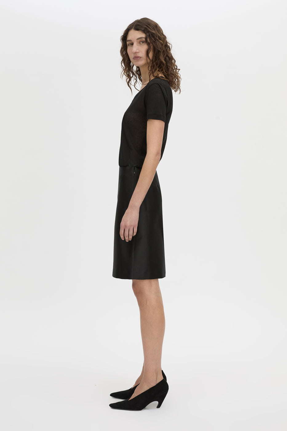 Side view CAMILLA AND MARC Sona Pencil Skirt in black with knee‑length hem.