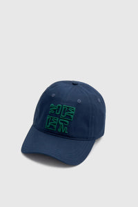 Three-quarter view CAMILLA AND MARC Sonora Embroidered Logo Cap in Deep Ink with embroidered artwork.