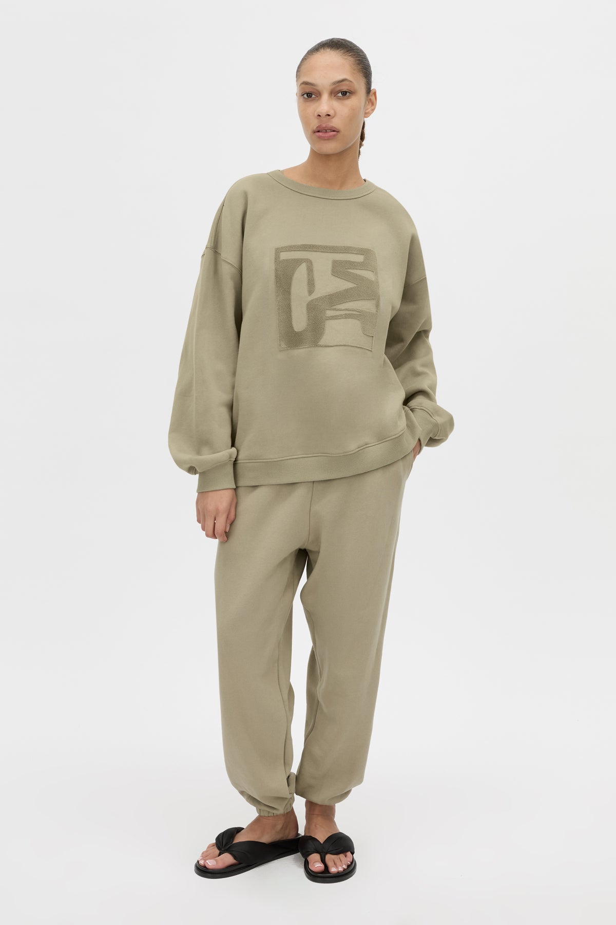 Front-styled view CAMILLA AND MARC relaxed Sonora Track Pant in clay gathered elasticated waistband.