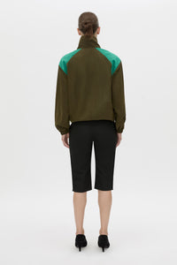 Back view CAMILLA AND MARC Storm Colour Block Anorak in khaki emerald with contrast shoulder panels and a funnel neckline.