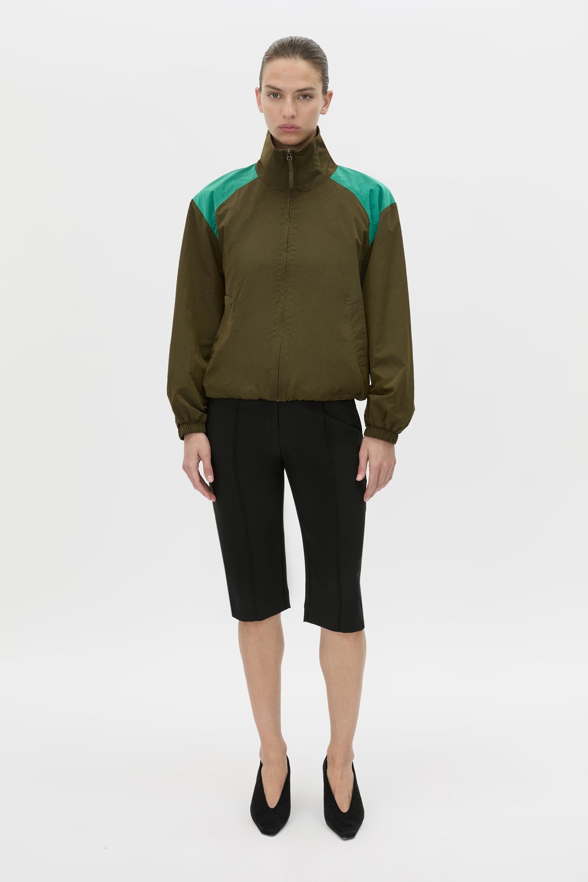 Front-styled view CAMILLA AND MARC Storm Colour Block Anorak in khaki emerald with contrast shoulder panels and a funnel neckline.