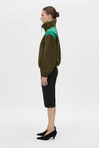 Side view CAMILLA AND MARC Storm Colour Block Anorak in khaki emerald with contrast shoulder panels and a funnel neckline.