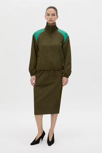 Styled view CAMILLA AND MARC Storm Colour Block Anorak in khaki emerald with contrast shoulder panels and a funnel neckline.