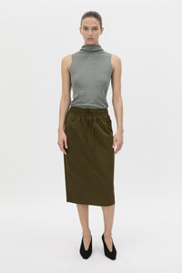 Front view CAMILLA AND MARC Storm Midi Skirt in khaki with an elasticated waistband, slanted side pockets and a back vent.