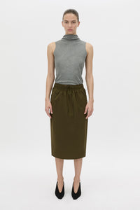 Front view CAMILLA AND MARC Storm Midi Skirt in khaki with an elasticated waistband, slanted side pockets and a back vent.