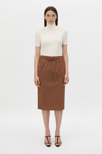 Front view CAMILLA AND MARC Storm Midi Skirt in mocha with an elasticated waistband, slanted side pockets and a back vent.