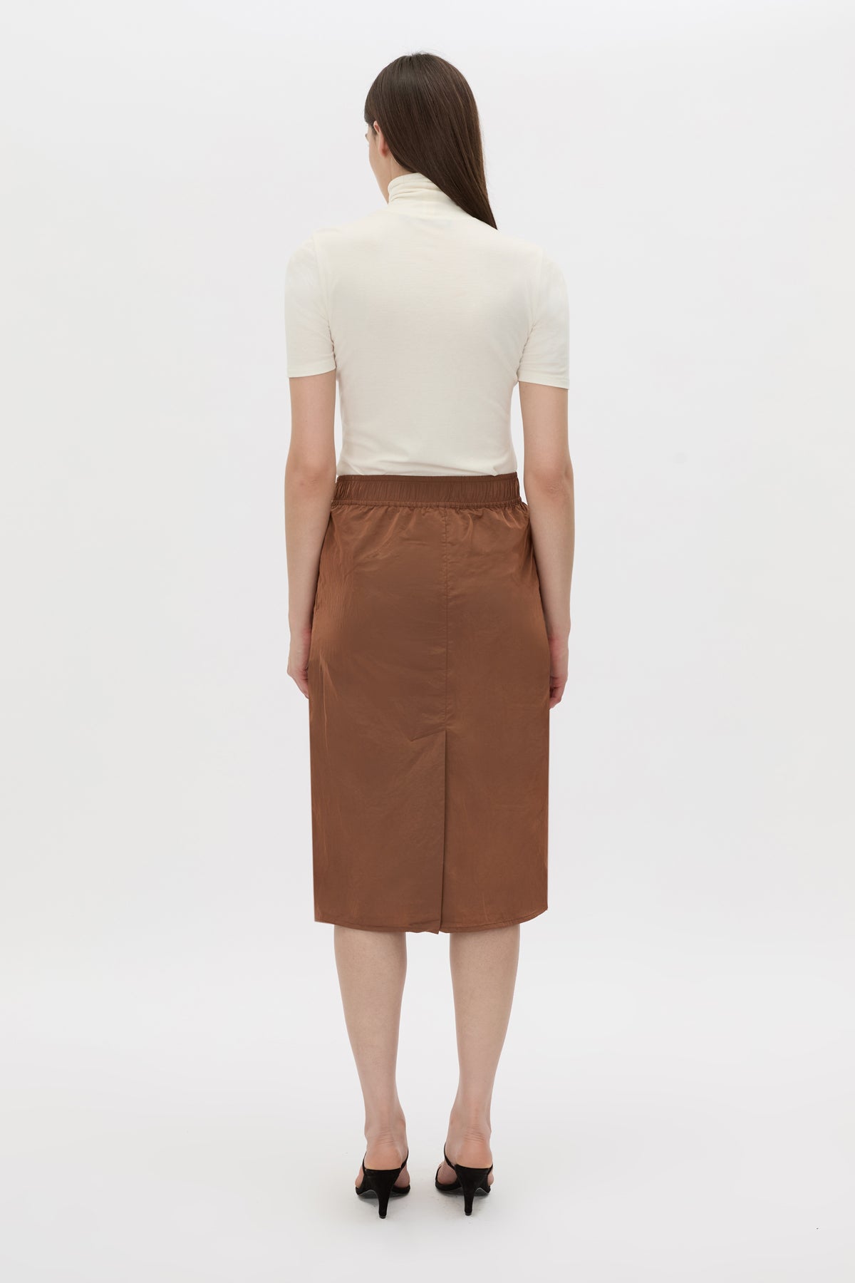 Back view CAMILLA AND MARC Storm Midi Skirt in mocha with an elasticated waistband, slanted side pockets and a back vent.