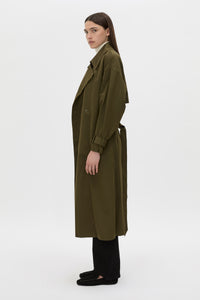 Side view CAMILLA AND MARC Storm Trench Coat in khaki with concealed snap fastenings, in seam pockets and a self tie belt with sleeve straps.