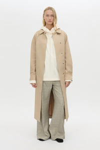Front view CAMILLA AND MARC Studio Hoodie in White styled with the Mahdavi Trench.
