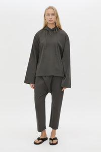 Front styled view CAMILLA AND MARC Studio Hoodie in Coal with relaxed long‑sleeve design and hooded silhouette.  