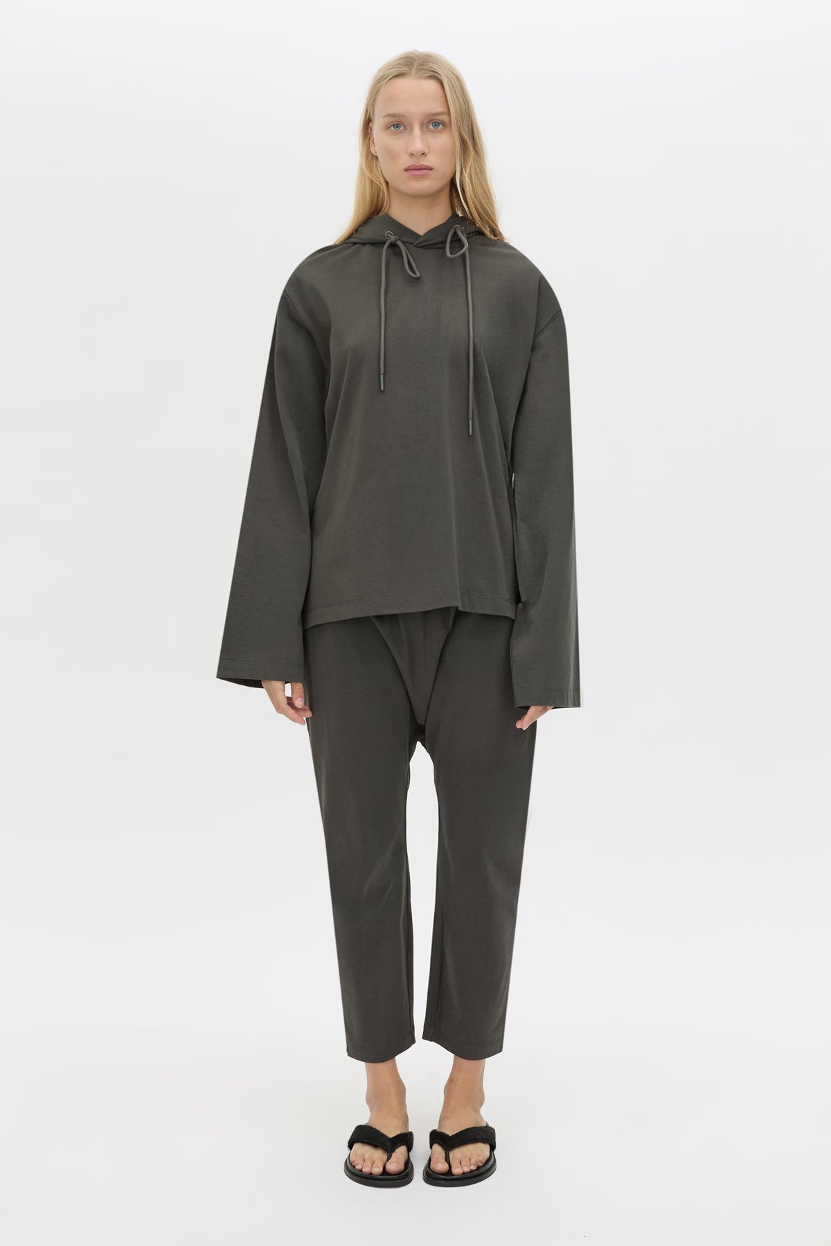 Front view CAMILLA AND MARC Studio Hoodie in Coal with relaxed long‑sleeve design and hooded silhouette.  