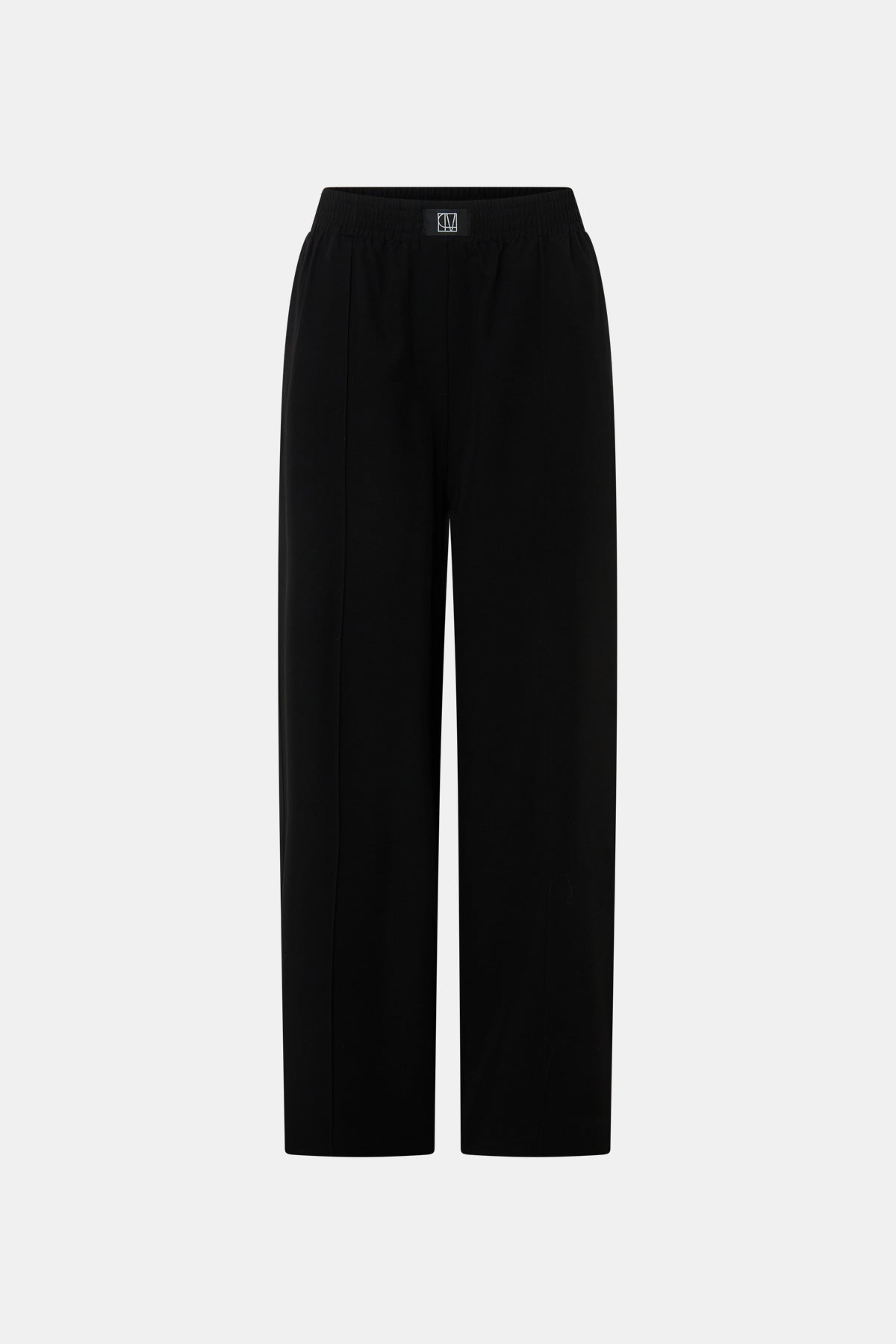 Ghost view CAMILLA AND MARC Sylvia soft suiting high-waisted pant in black with monogram patch at waistband.