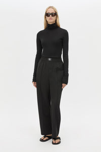 Front view CAMILLA AND MARC Sylvia soft suiting high-waisted pant in black with monogram patch at waistband.