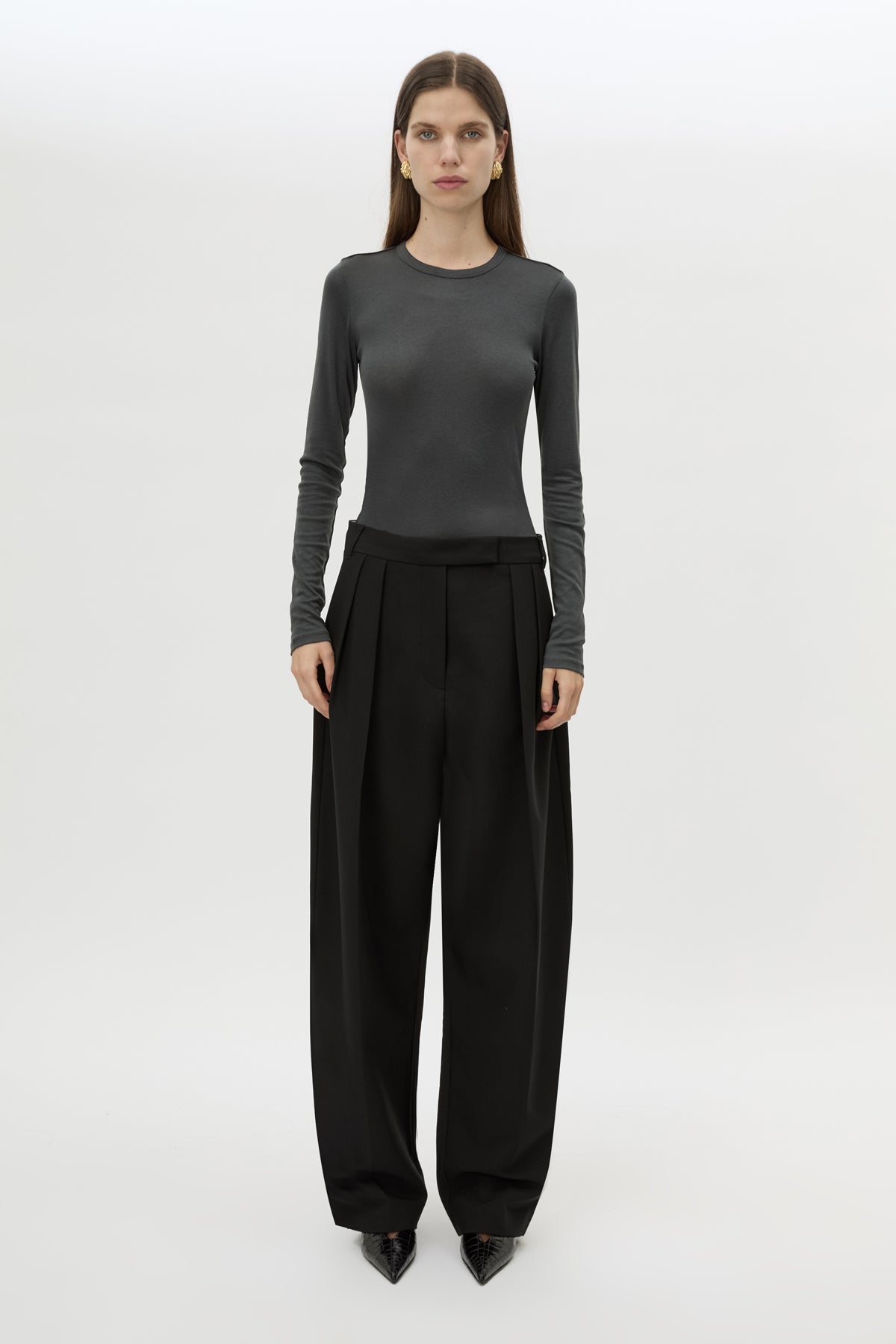 Front styled view CAMILLA AND MARC Tala Double Pleat Barrel Leg Pant in Black with pressed tapered legs.